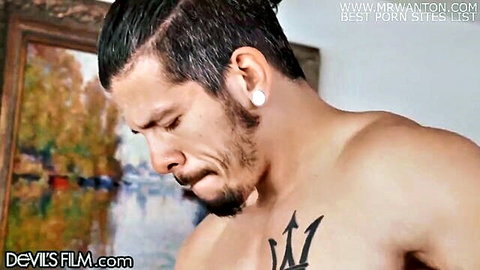 Muscular tattooed man in DevilsFilm scene with Kandie Monaee