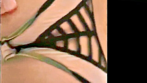 Asian escort in sexy black lace lingerie, deep cleavage tease