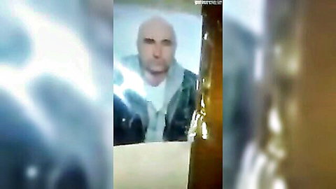 Blurry thumbnail of bald Caucasian man in hoodie from Bosnian girl amateur porn video