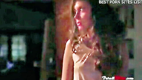 Seductive Indian wife in low-cut dress teasing glance