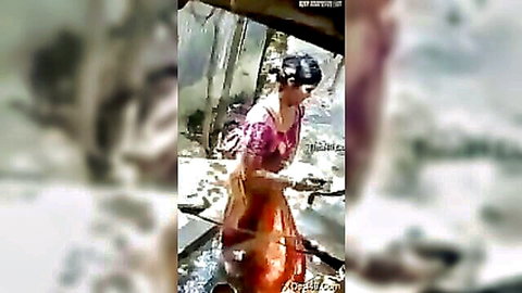 Desi Bhabhi bathing in wet saree, curvy Indian woman outdoors