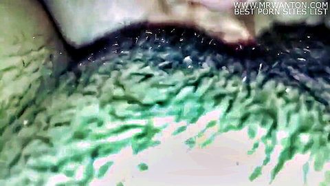 Close-up view of wet pussy with pubic hair and natural folds