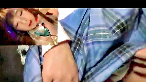 Asian schoolgirl in plaid uniform giving intense blowjob close-up