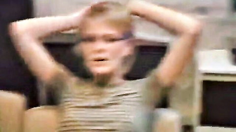 Amateur blonde girl with glasses in striped shirt looking surprised