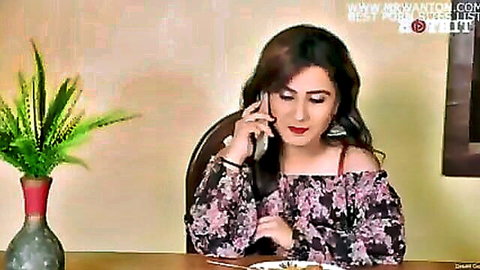 Sexy Indian woman in floral off-shoulder top on phone call, desi erotic tease