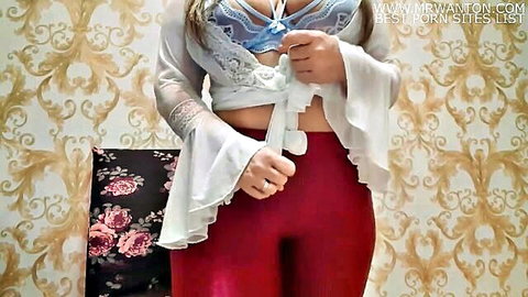 Marcia teasing in sheer lace top and tight red leggings, curvy Brazilian beauty