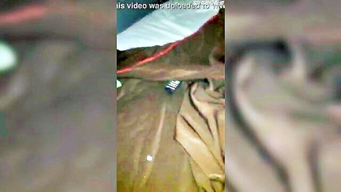 Blurry amateur motel bed scene with scattered clothes