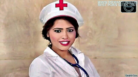 Seductive Indian nurse in white uniform smiling teasingly