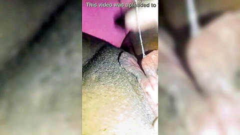 Blurry close-up of aroused woman with string insertion in genital area