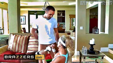 Brandi Love in blue tank top shakes Keiran Lee's dick like weights in sports scene