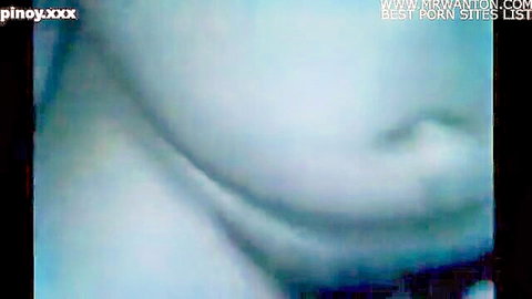 Blurry close-up of woman's open mouth sucking cock in low-quality homemade blowjob.