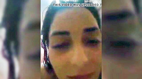 Blurry close-up of aroused Arab woman's face with eyes half-closed in ecstasy.