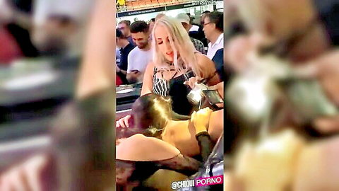 Carolina Abril performs cunnilingus on a woman in public