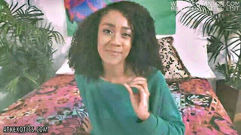 Bubbly Ariana Aimes smiling in green sweater, hinting at lactation play