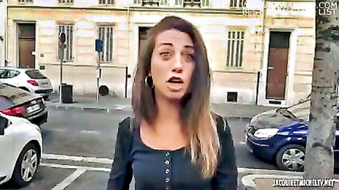 Shocked brunette with open mouth standing on French street in buttoned top