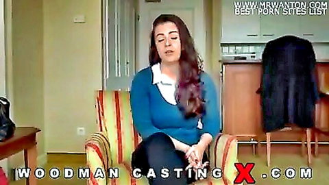 Alexis in Woodman Casting, seated in blue sweater and pants