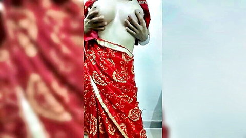 Petite Indian woman in red saree squeezing her small perky tits and hard nipples