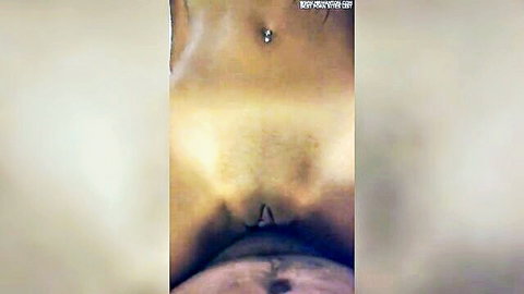 Close-up of Asian woman's shaved pussy and belly piercing