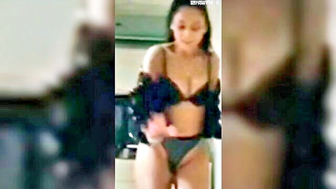 Sexy Asian babe in black bra panties and feathered shrug teasing seductively