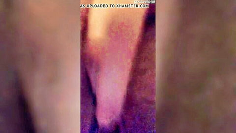 Blurry close-up of woman masturbating solo