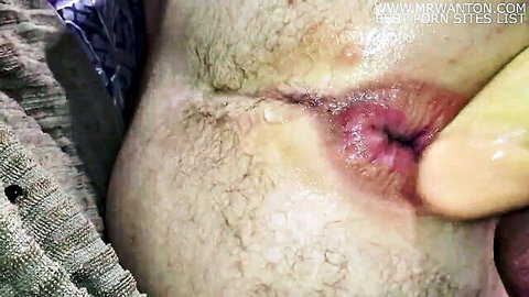 Close-up anus stretched by yellow suction cup dildo in intense anal play