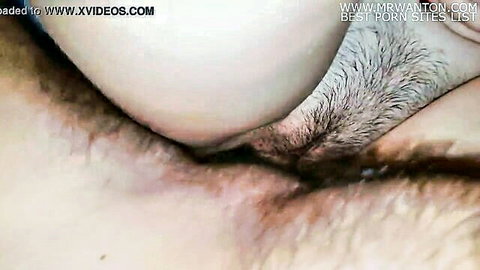 Closeup of hairy pussy with thick cum dripping out after creampie