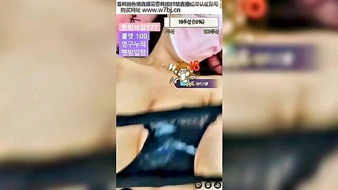 Young Korean webcam babe exposes big tits in topless solo striptease