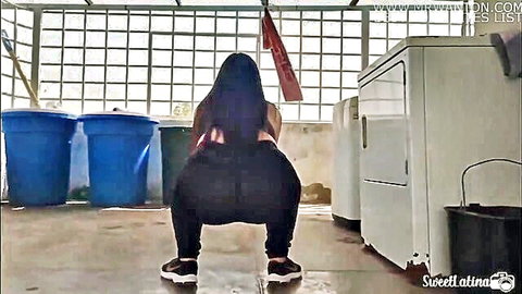 Latina with huge ass squatting in tight pants for anal plug training