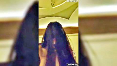 Desi Delhi girlfriend with long black hair posing from behind