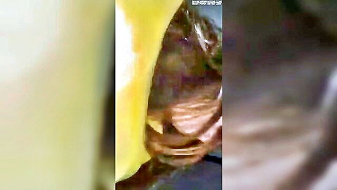 Blurry close-up of Asian woman in intense oral sex act, amateur style