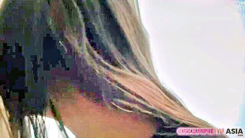 Close-up of Thai woman's long dark hair and neck in Asian adult video