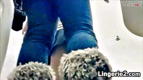 Big round ass cheeks exposed as tight blue jeans pulled down with fluffy boots