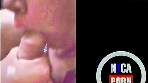 Closeup of woman's mouth sucking thick brown cock head during sloppy blowjob