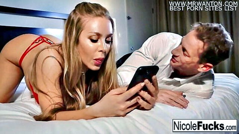 Blonde Nicole in red lingerie teases hot stud on bed while scrolling social media