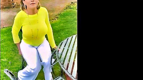 Mature blonde granny in yellow top flashing big natural boobs outdoors