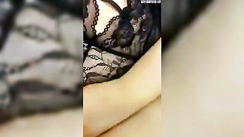 Seductive Egyptian woman in black lace lingerie, teasing pose