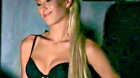 Hot blonde in black lingerie smiling during casting whip test