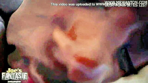 Blurry closeup of woman giving sloppy blowjob on thick cock with heavy watermarks