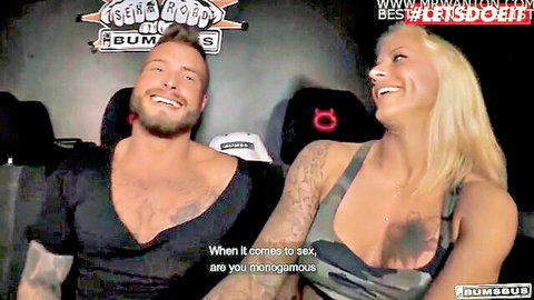 Big tits blonde MILF and athletic tattooed guy smiling on bus discussing sex