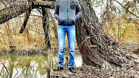 Step-son-in-law stands outdoors in jeans and hoodie, teasing mother-in-law fantasy