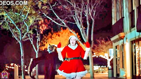 Sexy curvy Santa babe with big tits running from creepy cat stalker in public Xmas night street