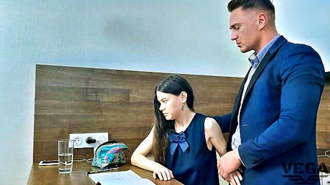 Teen stepsister in blue dress helps stepbrother at desk, intimate taboo moment