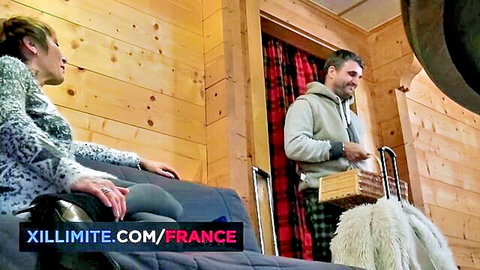 Sexy après-ski French couple lounging in chalet