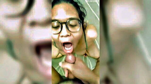 Asian woman with glasses giving blowjob, nice exposed tits in bikini