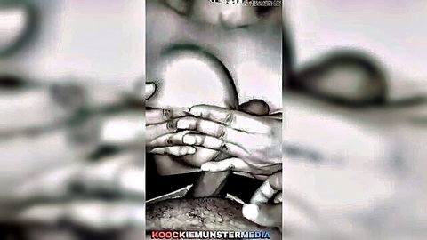 Black and white titty fetish close-up of hands cupping large breasts