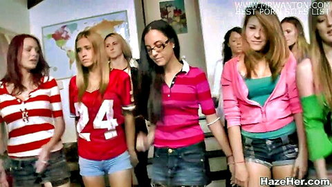 Group of young sorority pledges in casual jerseys and shorts, ready for hazing fun