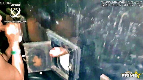 Bianca Naldy and Fada Mel in glory hole blowjob cabin taking cum