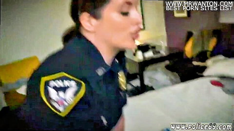 Blonde MILF cop in sexy uniform on bed, big tits, suggestive pose