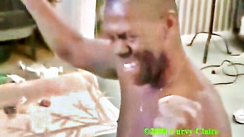 Muscular black man ejaculating shirtless in UK amateur video