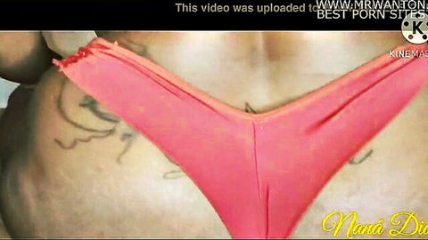Curvy Nana Di in pink thong swimsuit, teasing big ass with tattoos